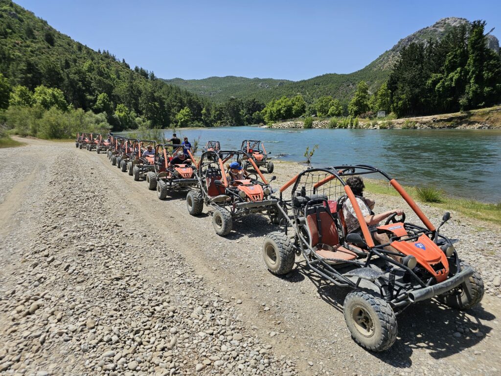 a group of people in a row of buggies