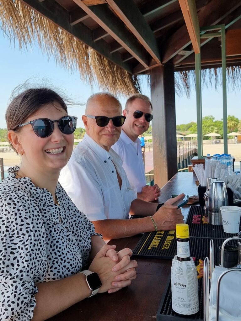 a group of people sitting at a bar